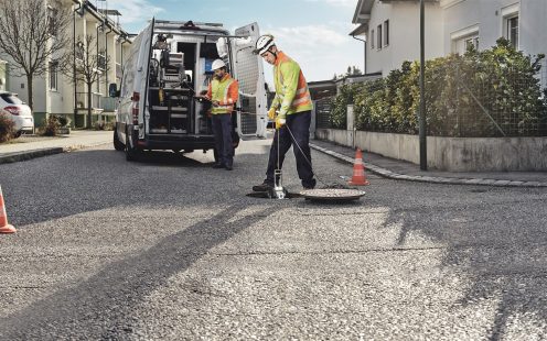 Wastewater two men inspecting wastewater system
